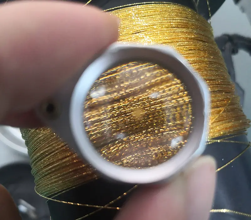 Automatic High-Precision Diamond Cutting Machine for Wire and Tube(Image2) Gold wire processed using a diamond cutting machine for wire and tube.