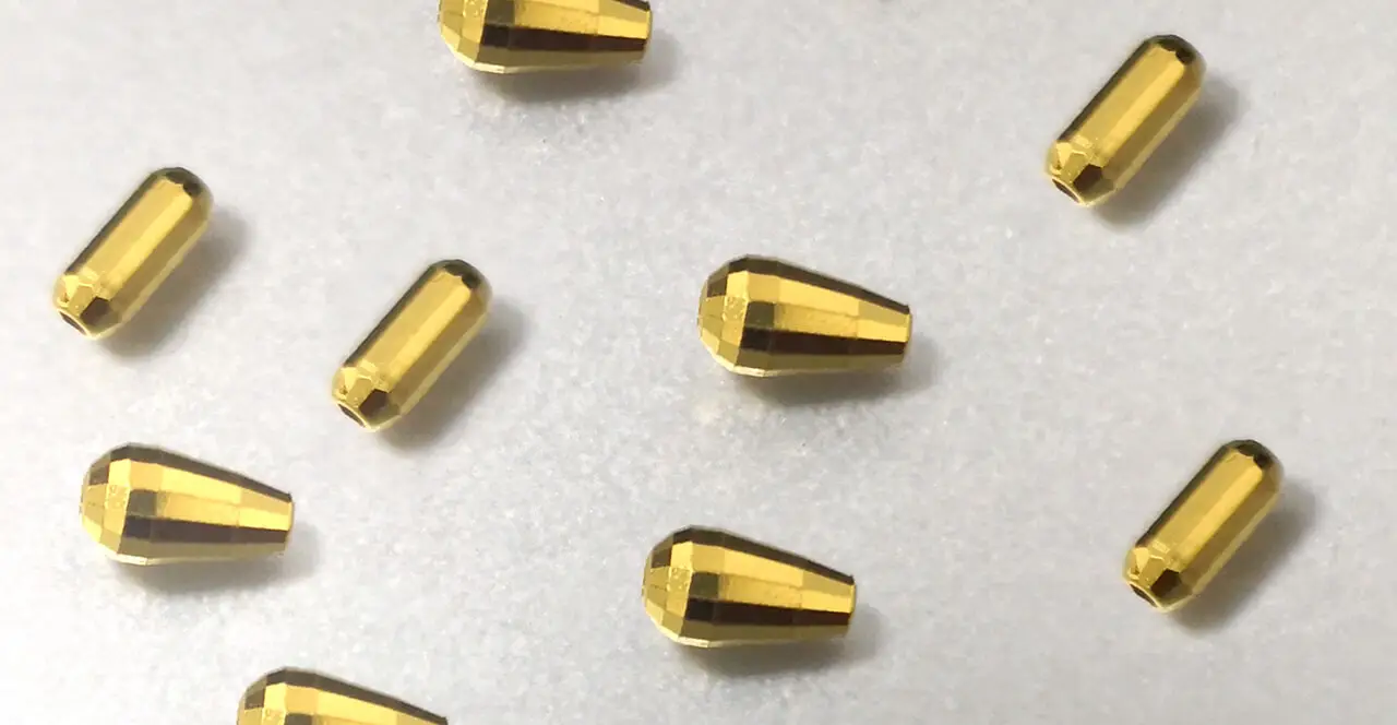 Ball Tube Diamond Cutting Machine(Image3) Bead cutting machine producing disco, laser, and twill decorative surface patterns on gold and silver jewelry beads